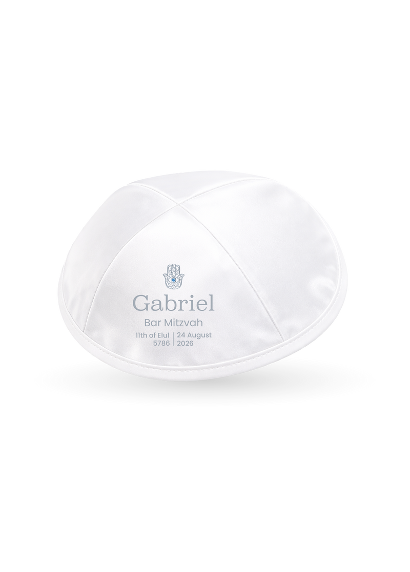 A custom Kippush kippah with a hamsa design and a name